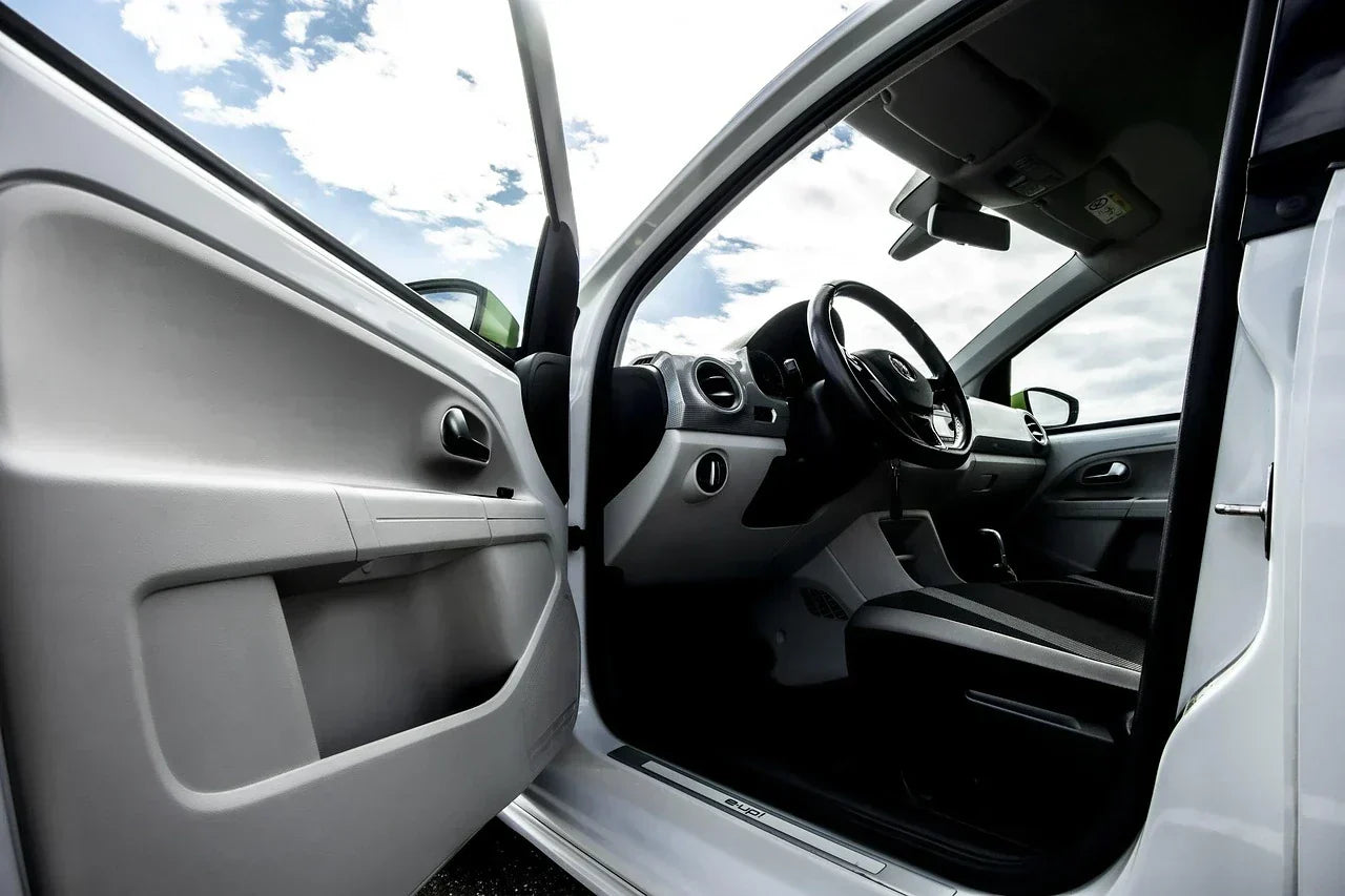Front car door interior showing door pocket storage area suitable for a car door pocket organizer