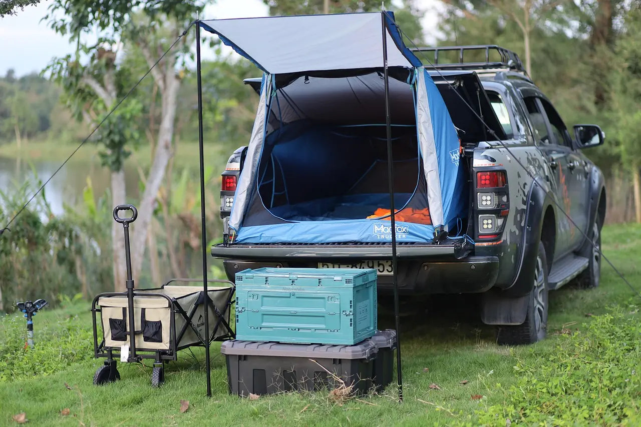 Ford Ranger truck bed camping setup with tailgate tent and outdoor accessories - Ford Parts Online