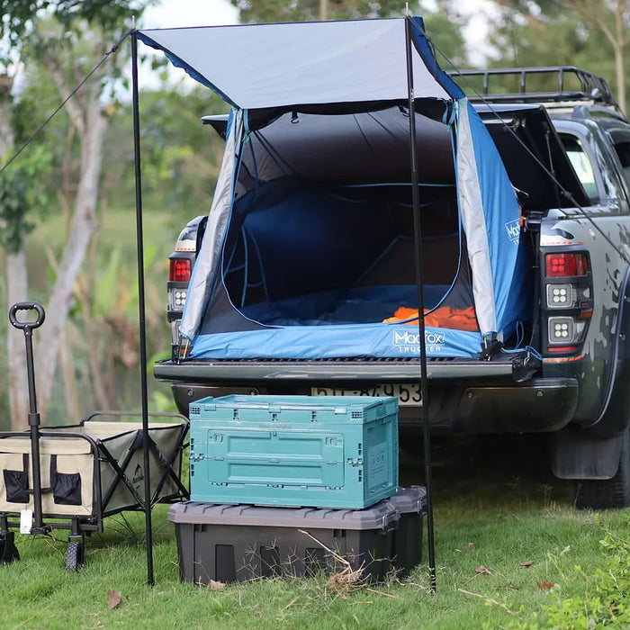 Ford Ranger truck bed camping setup with tailgate tent and outdoor accessories - Ford Parts Online
