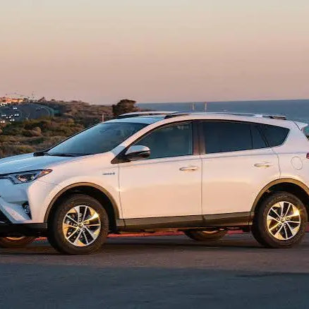 White Toyota RAV4 parked outdoors near the ocean, illustrating how to protect Toyota RAV4 interior from sunlight, wear, and outdoor elements.