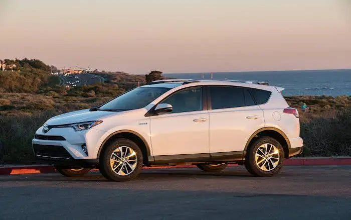 White Toyota RAV4 parked outdoors near the ocean, illustrating how to protect Toyota RAV4 interior from sunlight, wear, and outdoor elements.