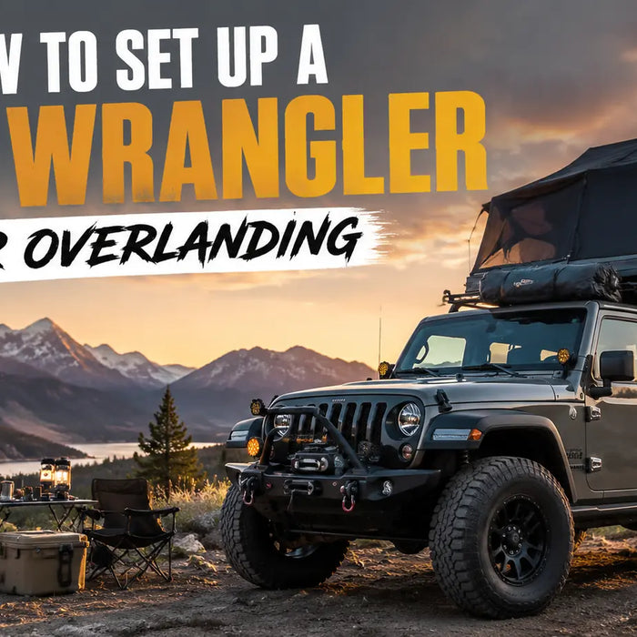 A fully equipped Jeep Wrangler ready for overlanding, featuring a rooftop tent, winch, and camping gear set up near a mountain lake during golden hour.