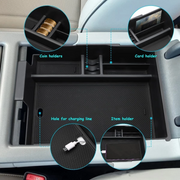 Coin slot and Charging cable hole design of Hyundai Palisade console tray