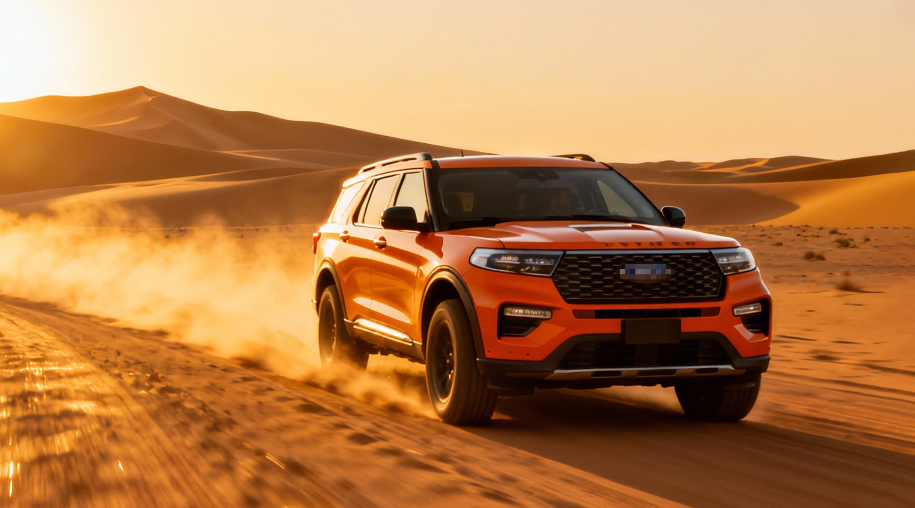 An orange off-road SUV driving on golden sand dunes with dust kicking up, desert sunset background.