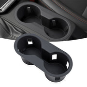 Black silicone cup holder insert for Ford vehicles, showing both the product and its installation in the center console.
