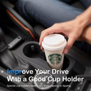 A hand placing a coffee cup into a car cup holder, highlighting how it prevents slipping or tipping to improve the driving experience.