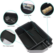 Multi compartment design of EV6 center tray with dedicated coin and card storage slots