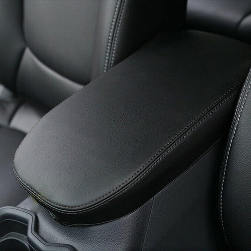 OEM style armrest cover installed on Toyota RAV4 center console