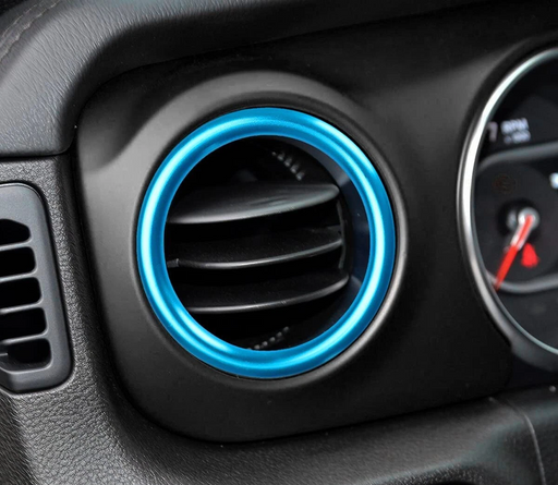 blue vent ring trim mounted on original vehicle air vent